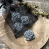 Organza zakje met 4 amberblokjes roos Black Musk